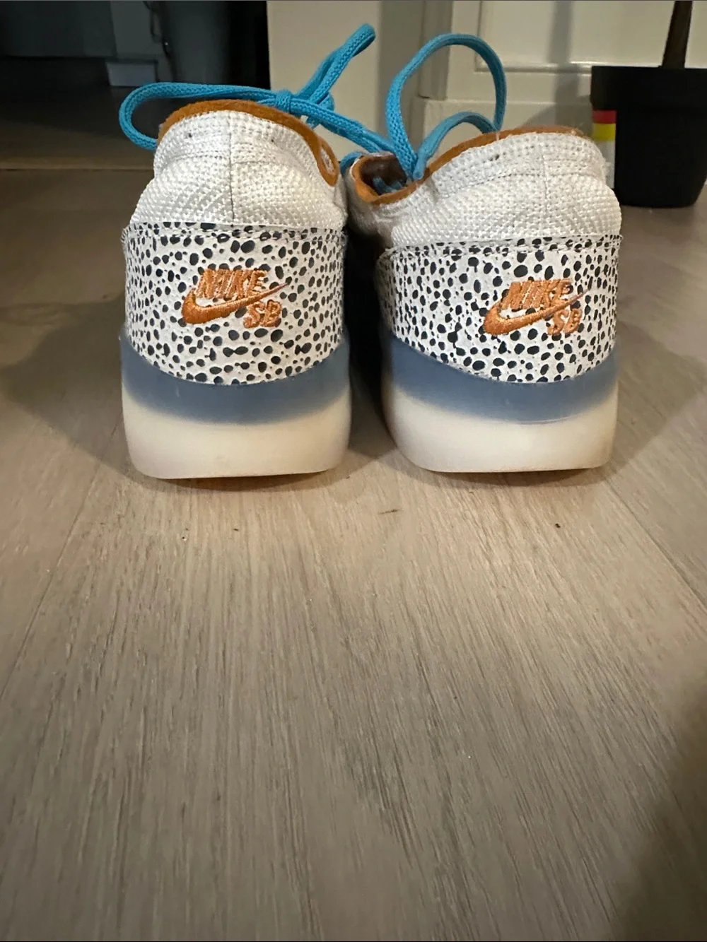 Nike Low-Top Sneakers in White with Black Swoosh and Turquoise Laces
